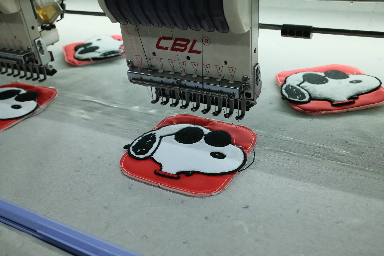 Multi-needle embroidery machine head used during bag development