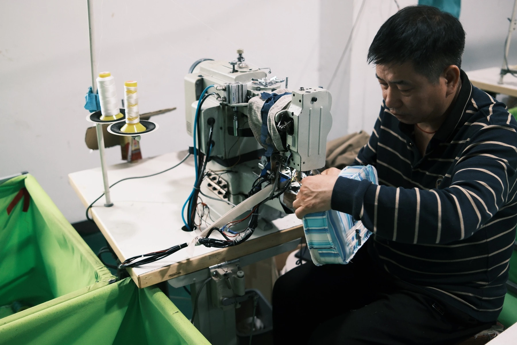 Bag maker working at a specialized sewing station